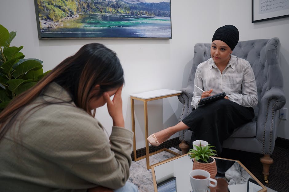 A woman discusses personal issues in a therapy session with a professional counselor.