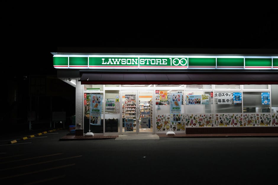 Exterior of Lawson Store 100 at night in Toyohashi, Aichi, Japan.