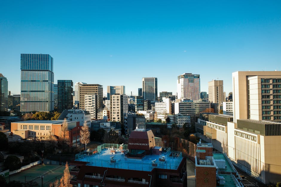View of Chiyoda City Tokyo featuring modern skyscrapers under a clear blue sky.