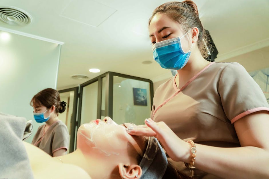 Women receiving facial treatments in a Hanoi spa, showcasing relaxation and wellness.