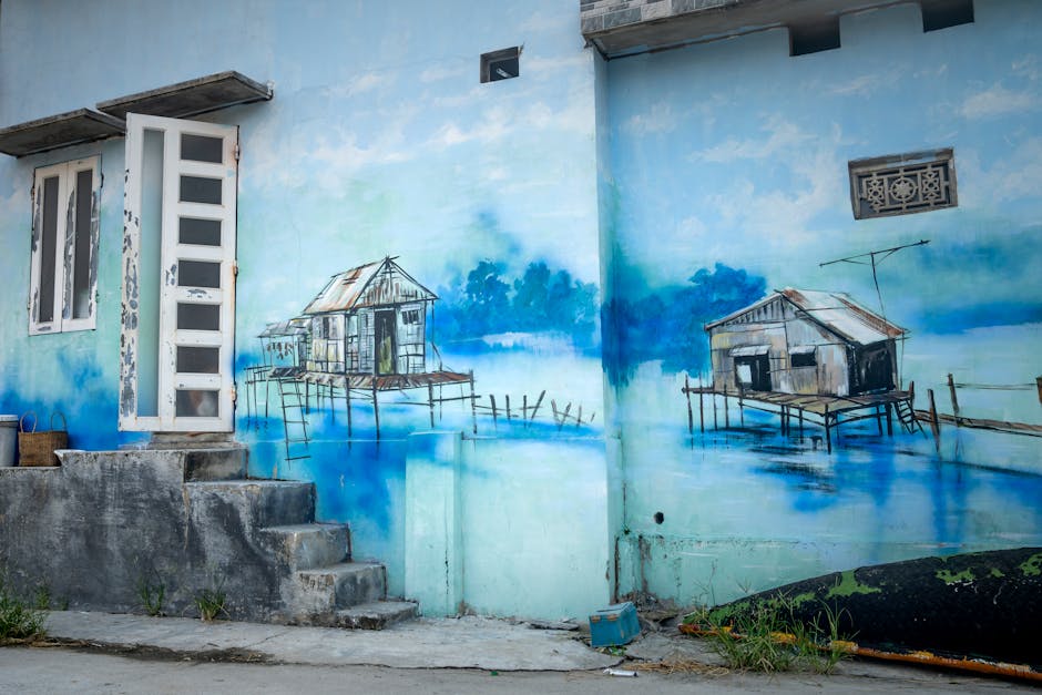 Exterior of house with aged stairs and shabby door and window and blue graffiti of houses water on wall
