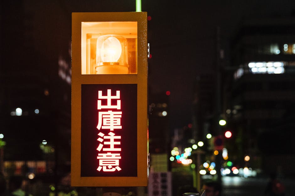 Brightly illuminated street sign in Chuo City, Tokyo, glowing at night.
