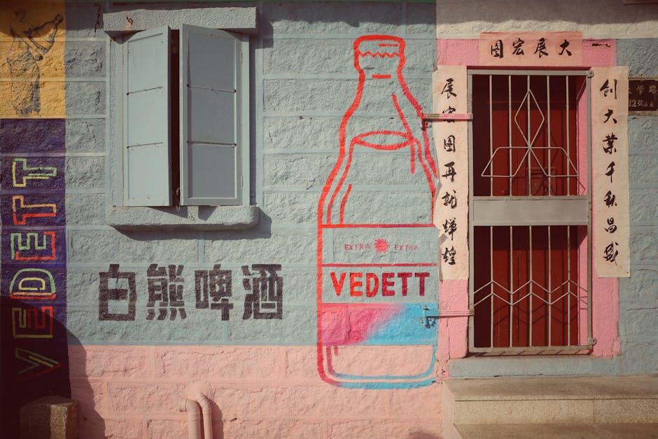 Vibrant mural depicting a large bottle and text on an urban wall. Cultural and artistic expression.