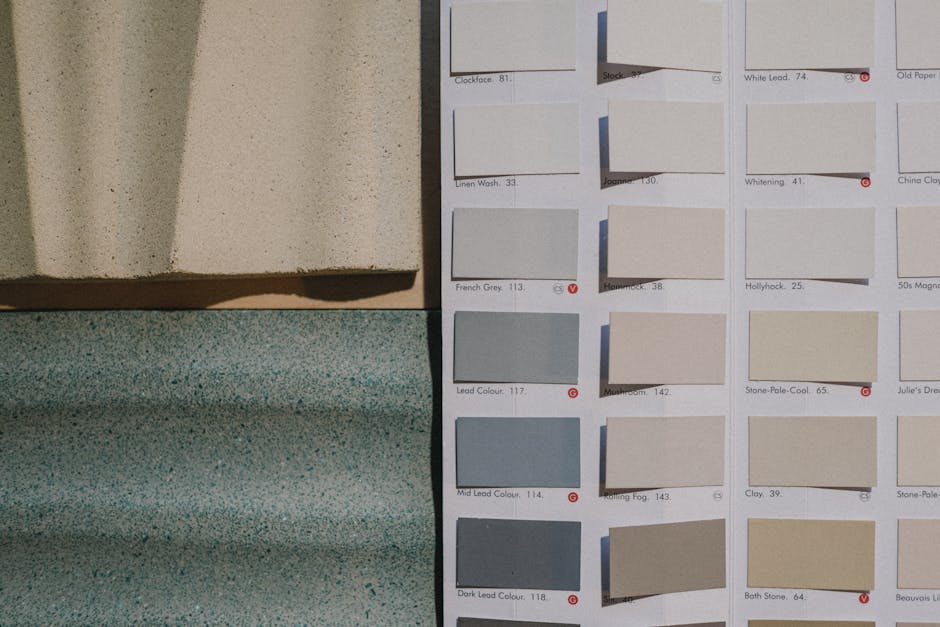 A detailed view of paint color swatches alongside textured material samples for design inspiration.