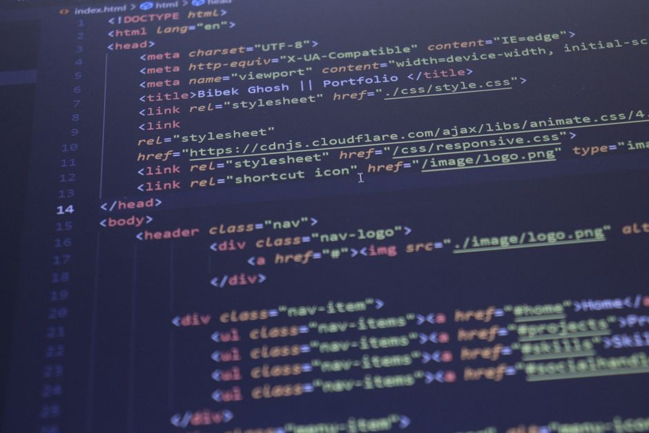 Close-up view of HTML and CSS code displayed on a computer screen, ideal for programming and technology themes.