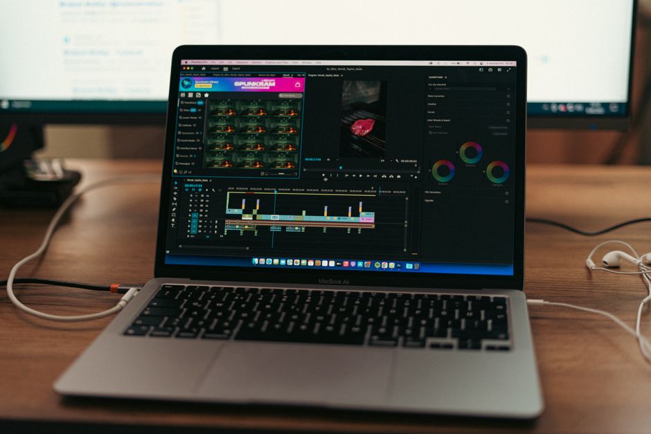MacBook Air setup with video editing software open, showcasing a typical workspace environment.