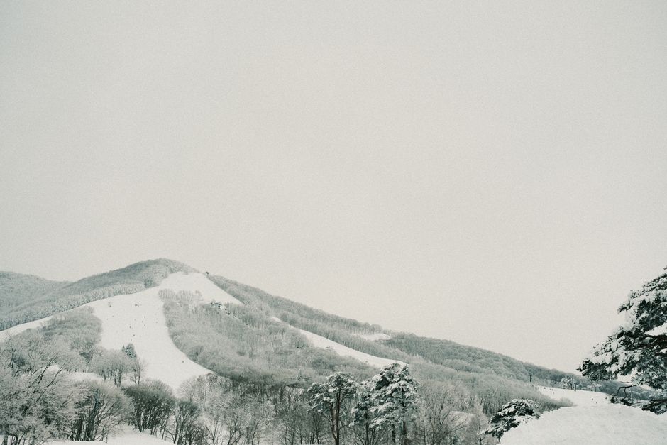 Serene snow-covered mountain landscape in Japan during winter.